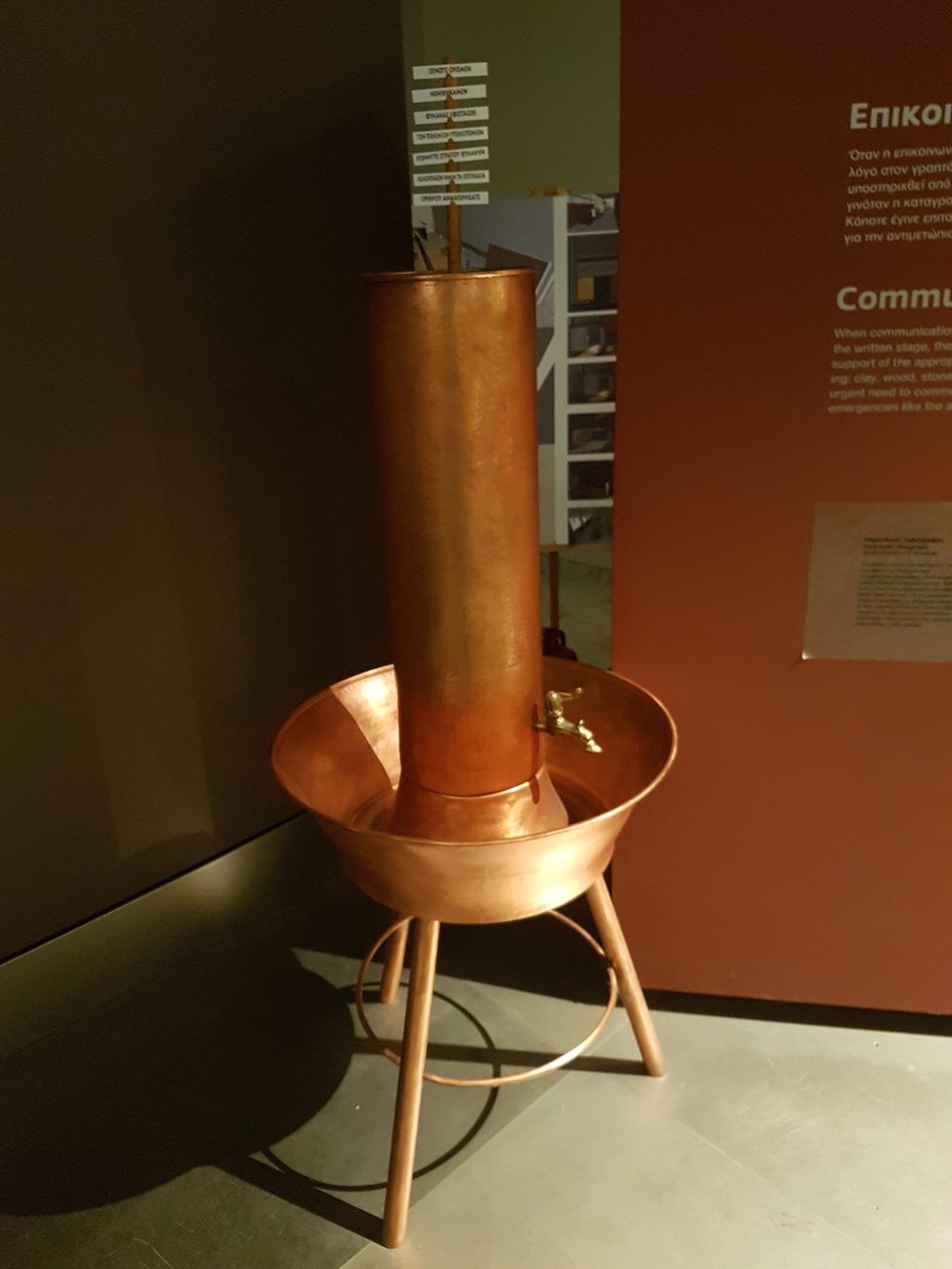 a metal chair sitting in front of a red wall, hydraulic and maritime semaphores, Hydraulic telegraph