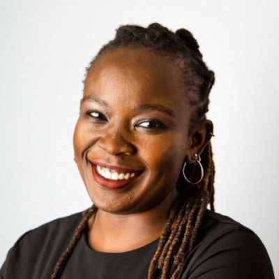 a smiling woman in black shirt and tie, Nanjira Sambuli, Nanjira Sambuli