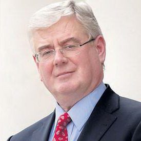  Face, Head, Person, Photography, Portrait, Formal Wear, Adult, Male, Man, Clothing, Suit, Indoors, Coat, Accessories, Glasses, People, Eamon Gilmore