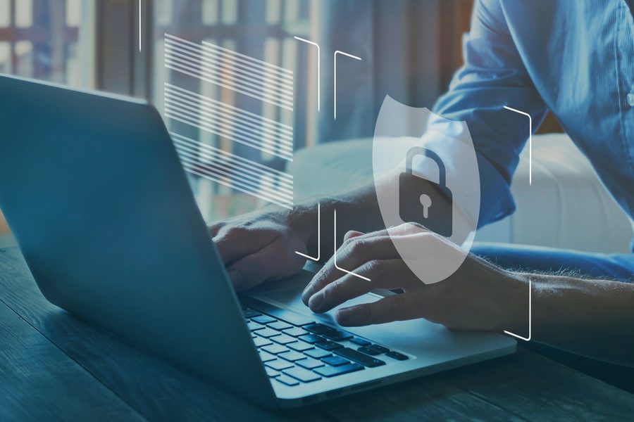 man typing on comuputer