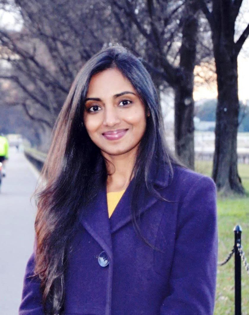  Head, Person, Face, Black Hair, Hair, Adult, Female, Woman, Clothing, Coat, Blazer, Jacket, Photography, Portrait, Dimples, Happy, Smile